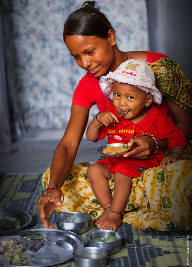Woman and baby eating a meal.