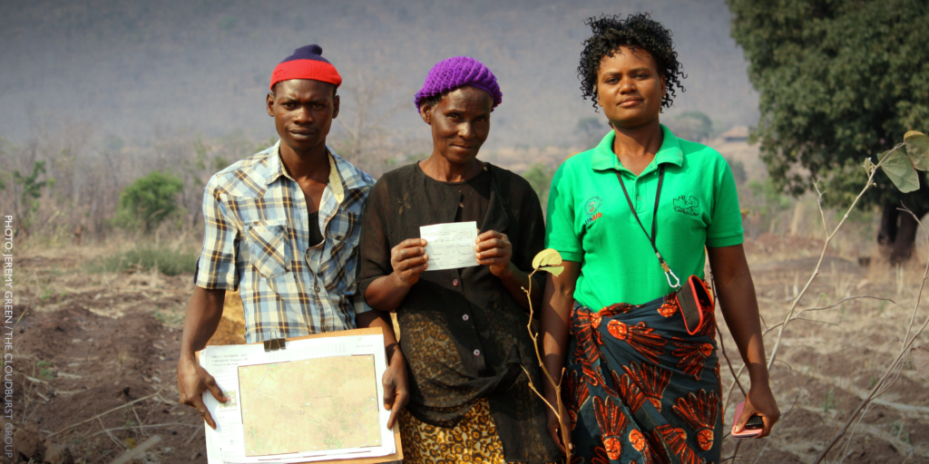 Three community members who mapped and recorded boundaries to certify customary land rights.