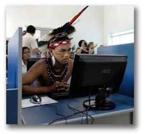 Indigenous man sitting at a computer