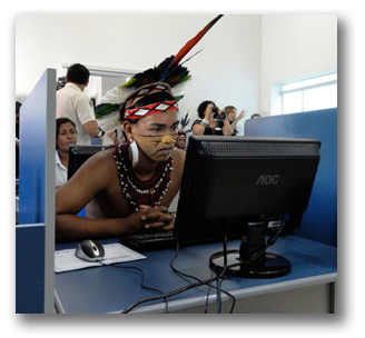 Indigenous man sitting at a computer