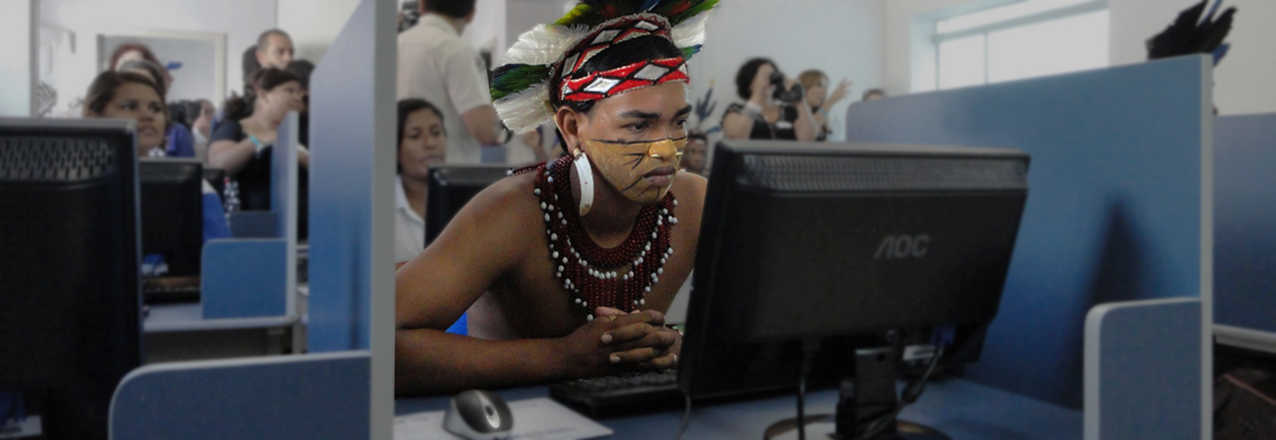 A young Brazilian man checks out the new computer center in the city of Cabrália, Brazil