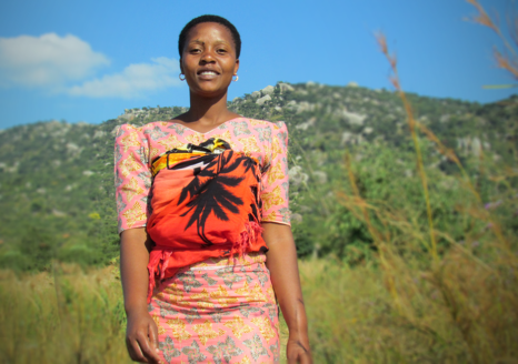 Tanzanian woman in a field.