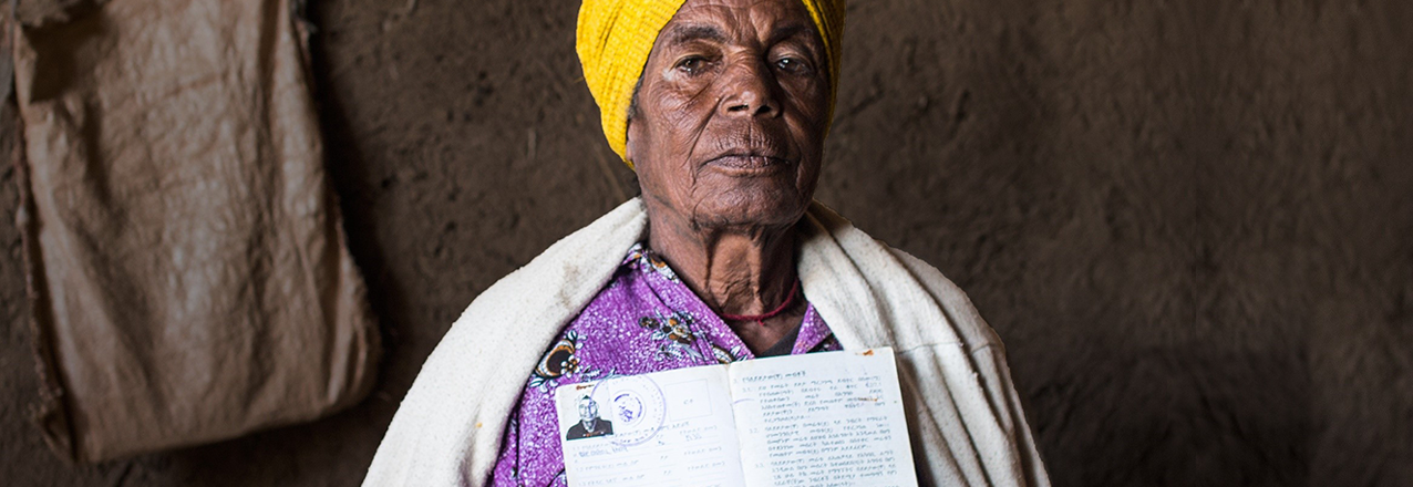 Ethiopian woman holding a land certificate