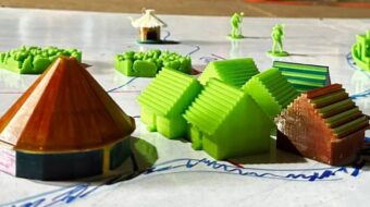 a model of a neighborhood, residents, and greenery